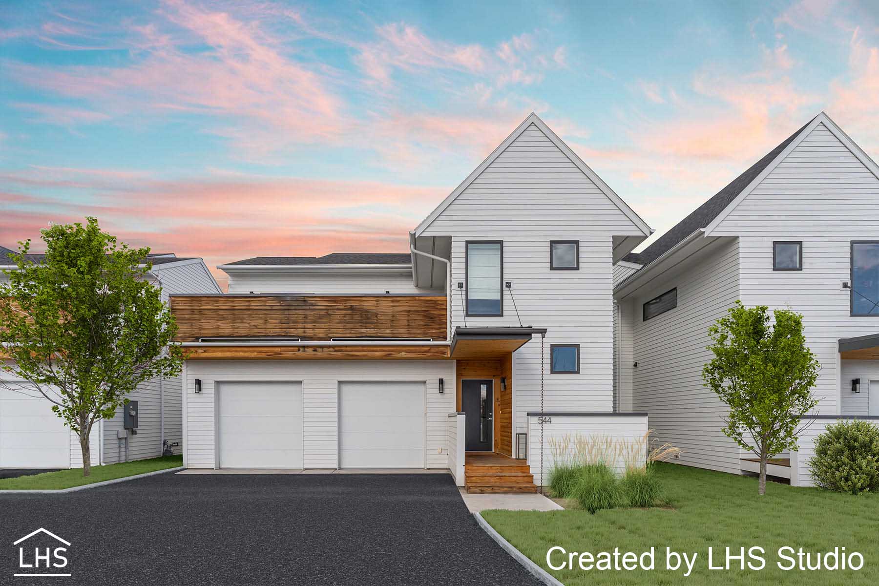 A beautifully enhanced exterior featuring a lush green lawn, designated parking space, and a vibrant sunset sky.